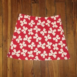 Red and white flower patterned zip up mini skirt